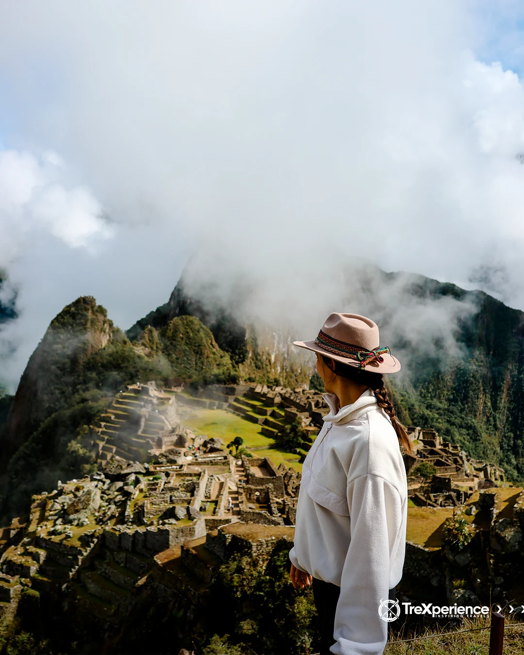 Machu Picchu Woman with a hat looking at Machu Picchu | TreXperience