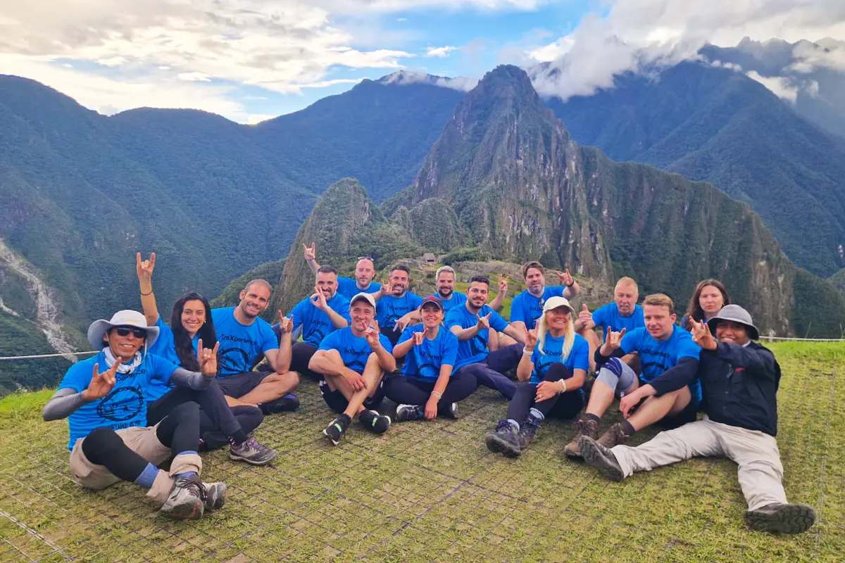 Tourist in Machu Picchu after Inca Trail Tourist standing in the ancient citadel of Machu Picchu after Inca Trail